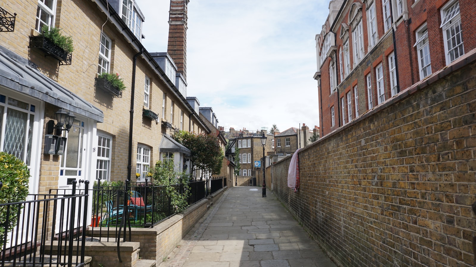 A quiet mews between period brick houses in Kensington and Chelsea