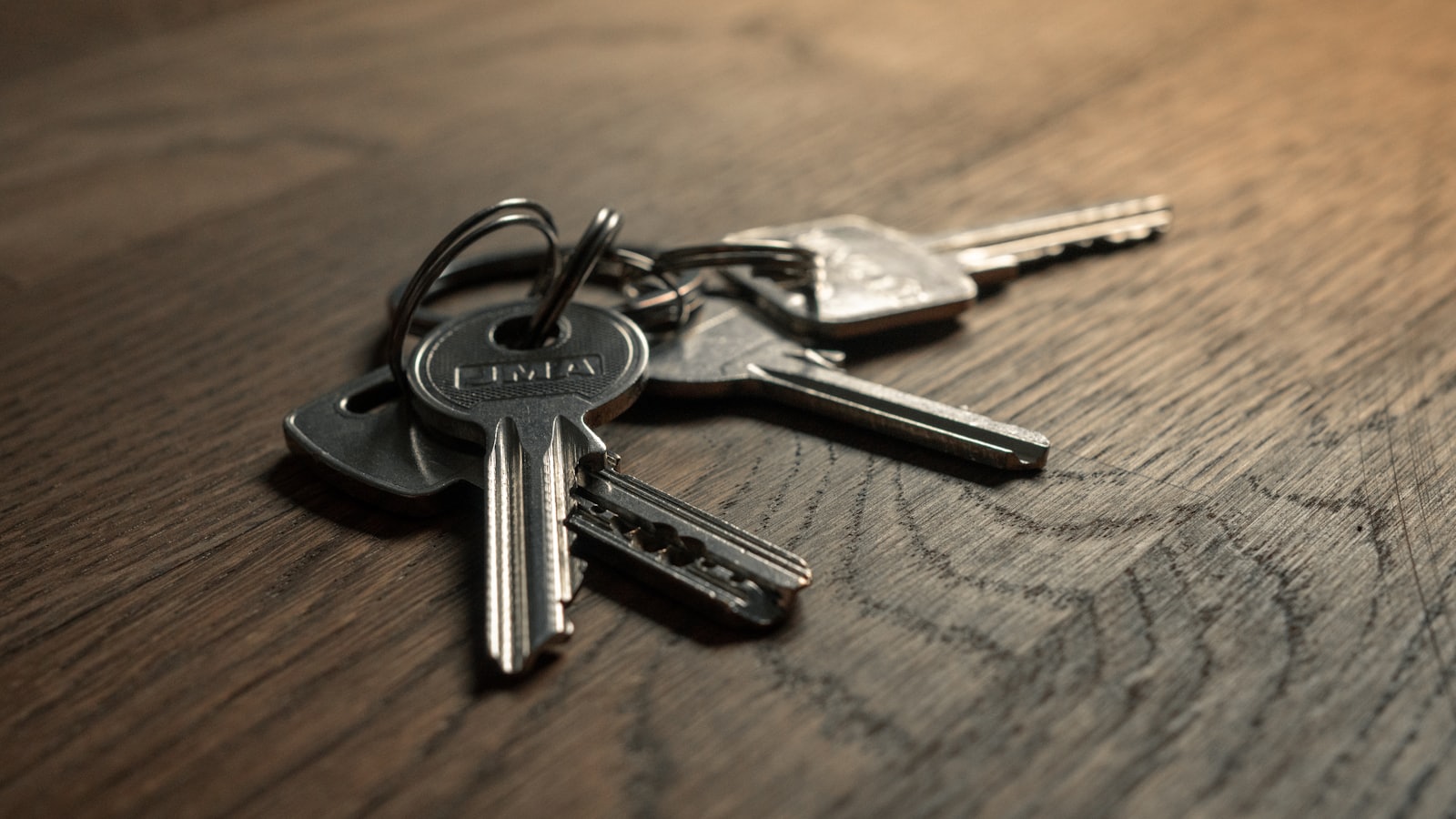 A set of numbered keys resting on a wooden table